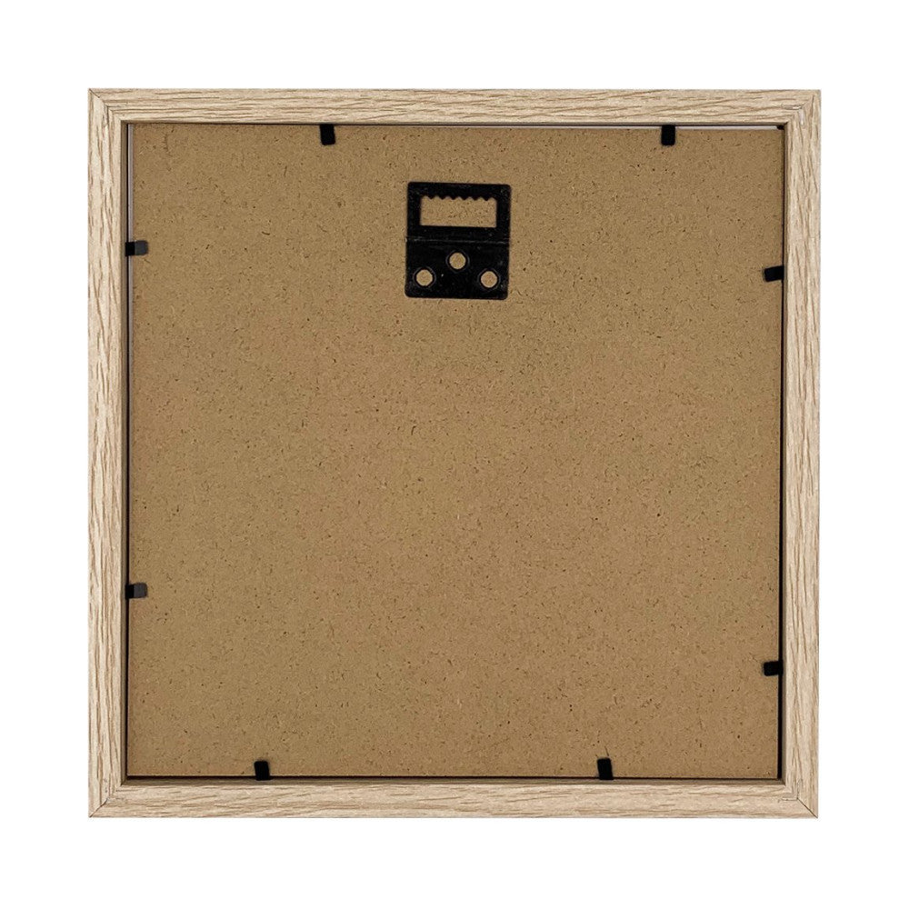 Rear view of wooden frame showing cork backing with black metal hanging hardware and wire attachment points.
