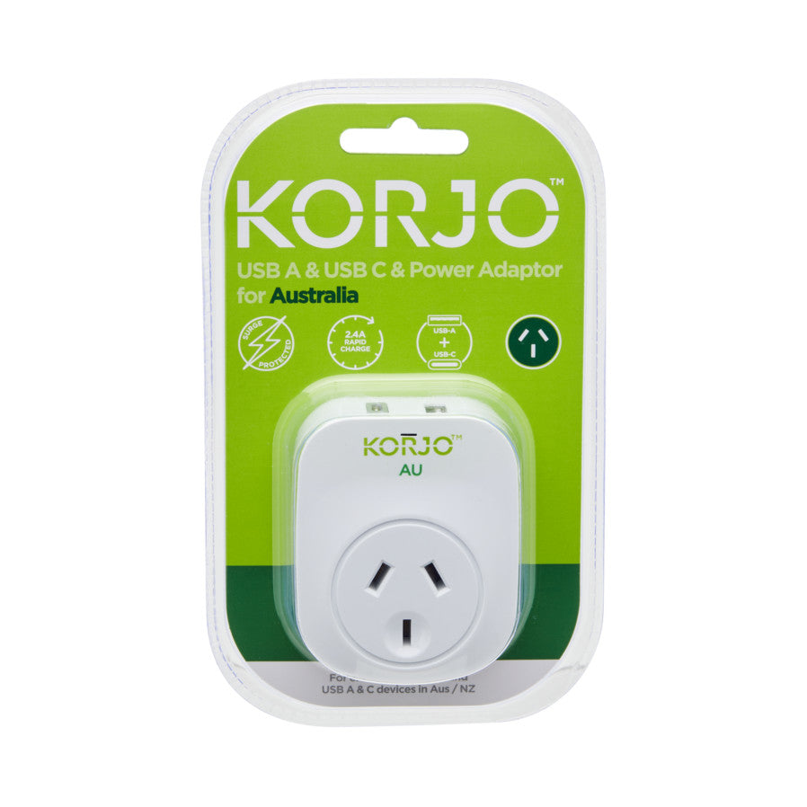 Korjo USB power adaptor for Australia in packaging, showing front view with white device, green branding, and Australian outlet prongs visible.