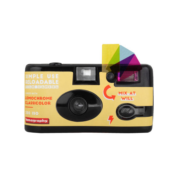 Yellow and black disposable film camera shown from the front angle, displaying the viewfinder, flash, and rewind mechanism with colorful color wheel graphic on top.