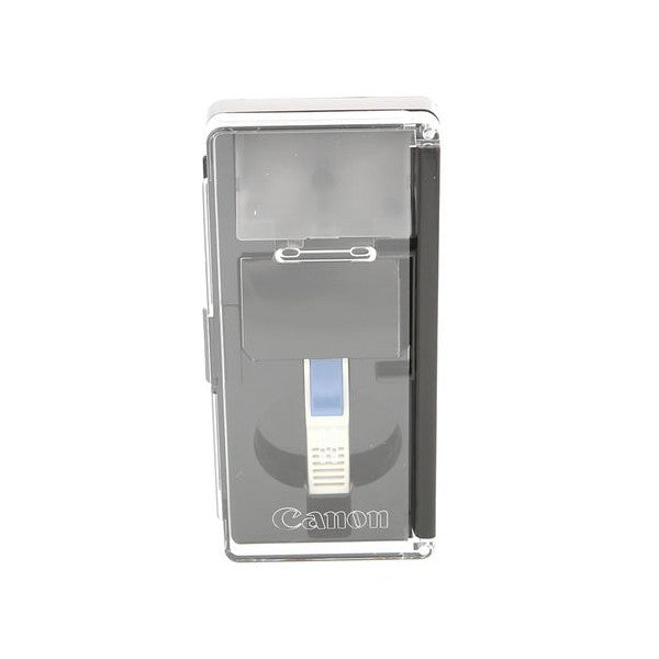 Top-down view of Canon EC-D laser matte product showing clear packaging with gray interior compartments and white label section visible through transparent case.