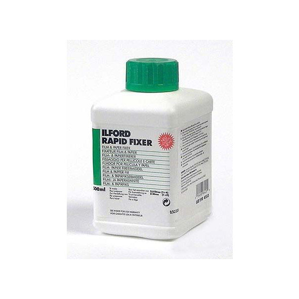 Front view of Ilford Rapid Fixer 500mL bottle with green cap and white plastic container against white background.