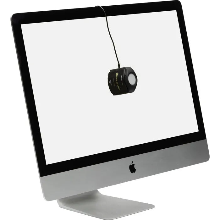 Computer monitor with a black cube attached to it on a white background
