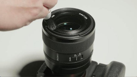 Camera lens with 'Sony' branding on a white background
